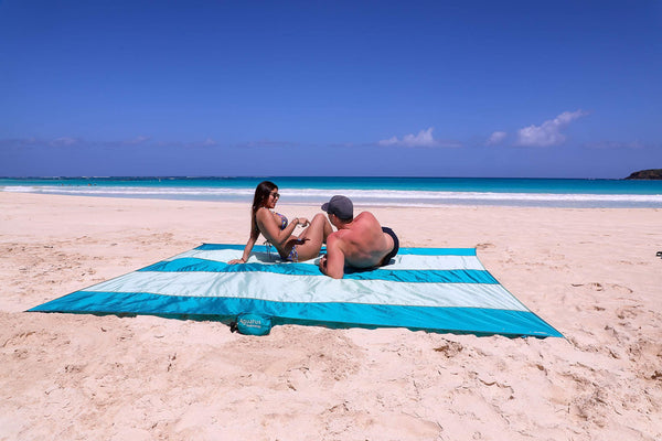 AQUATUS Premium XXL Beach Blanket Sandproof Water Resistant Quick Dry Mat 10ft by 9ft for 1-8 Adults with 4 Metal Stakes, 4 Corner Pockets, Secure Clip and Strap, and Attached Bag