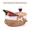 brown wicker picnic basket oval half open showing food