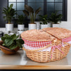 natural wicker picnic basket with red and white cloth closed