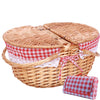natural wicker picnic basket with red and white cloth insert