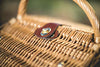 up close view of picnic basket wicker top clasp