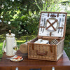 wicker brown picnic basket for two on wood table