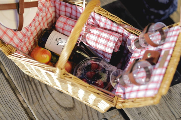 wicker natural picnic basket top view open with food