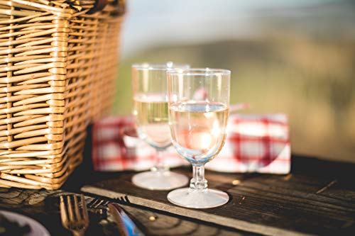 wicker picnic basket on table with two drinking glasses