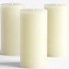 3 Standard Pillar Candles 3 inch diameter sitting on a white table