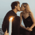 Two people kissing at the beach