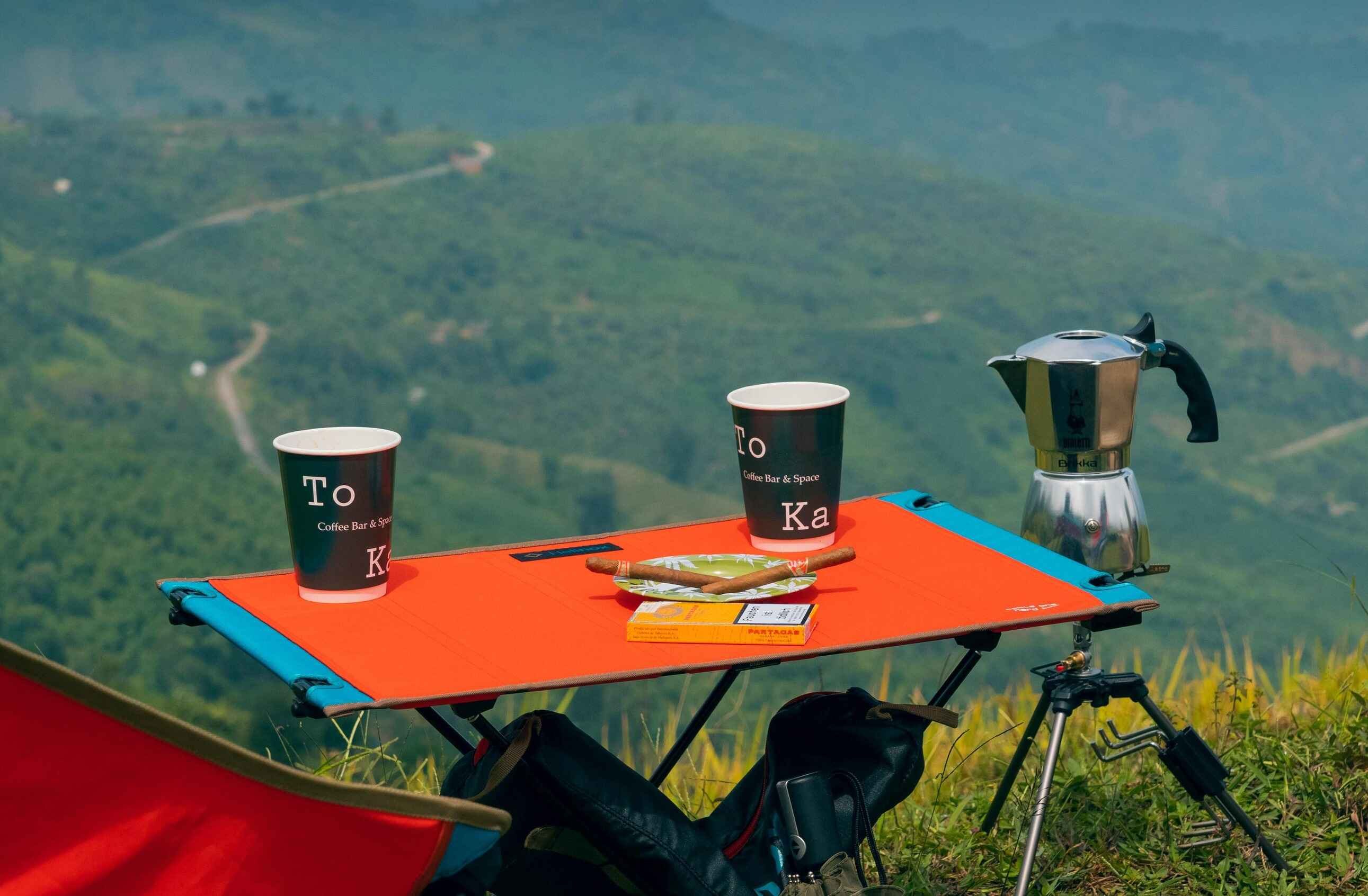 Folding backpacking table set up over a valley