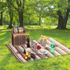 brown picnic basket on brown blanket with food