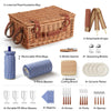 brown wicker picnic basket closed with blanket and utensils