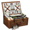 brown wicker picnic basket open showing 4 person cups and plates