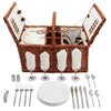brown wicker picnic basket open with plates, glasses, utensils