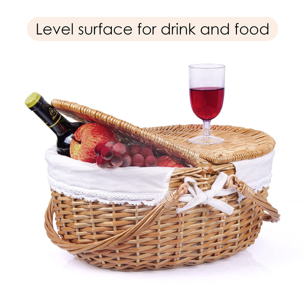 brown wicker picnic basket oval half open showing food