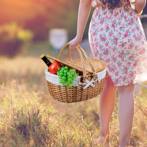 girl walking in grass with natural wicker picnic basket 