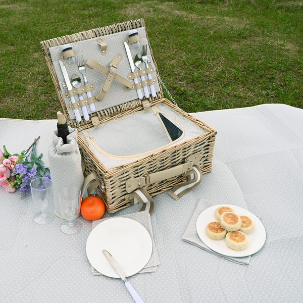 open picknic basket for 2 people on white blanket