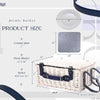 white wicker picnic basket closed with blue straps