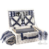 white wicker picnic basket open showing 4 person cups and plates