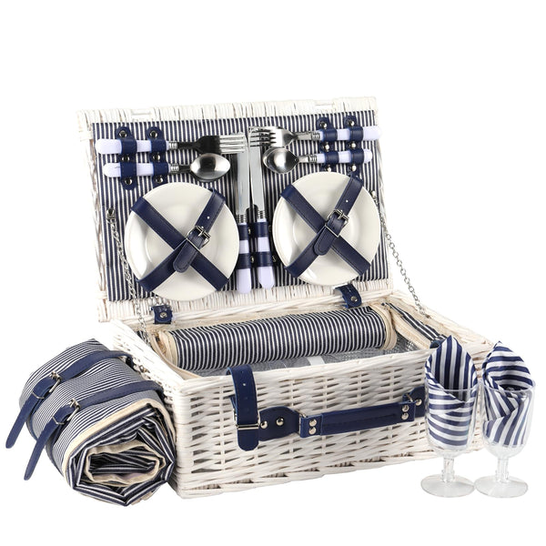 white wicker picnic basket open showing 4 person cups and plates