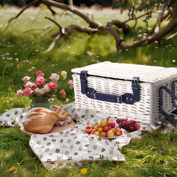 white wicker picnic basket  with blue handle and straps