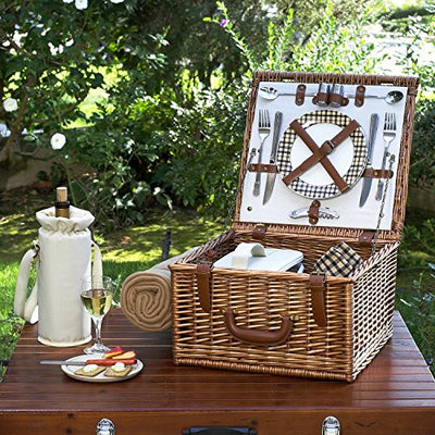 wicker brown picnic basket for two on wood table